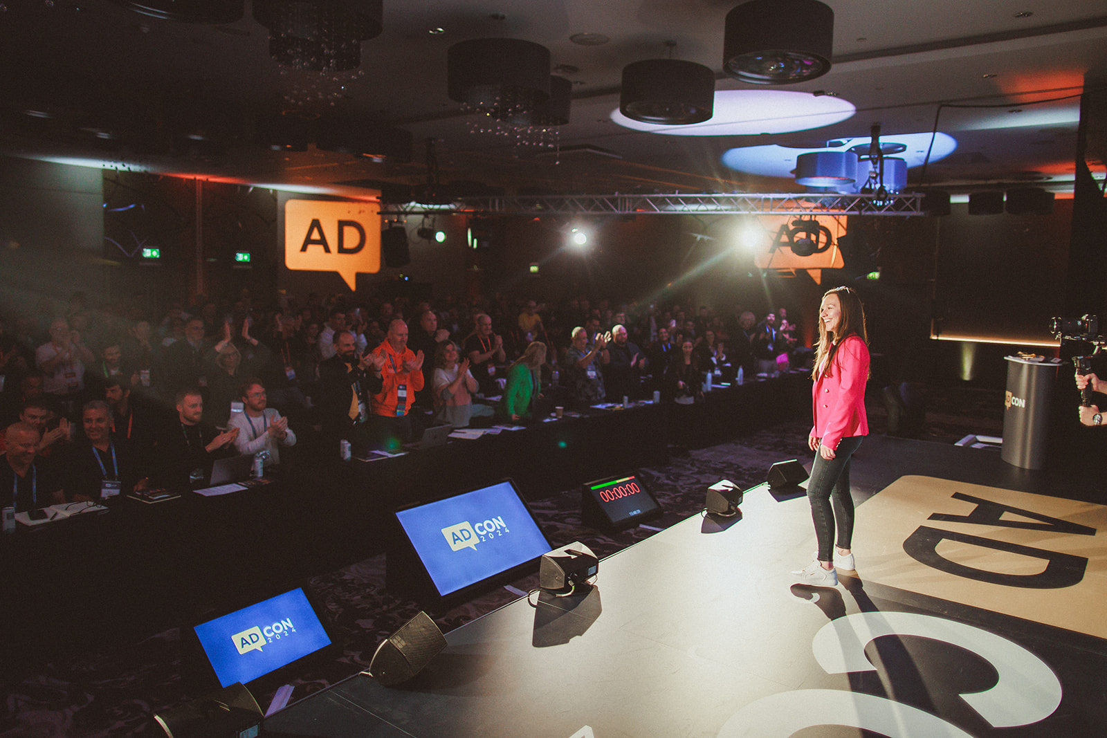 Cordelia on stage in front of an audience